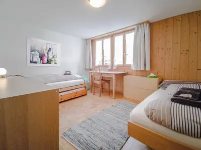 Ein Bett oder Betten in einem Zimmer der Unterkunft Chalet Guttannen EG - GRIWA RENT AG