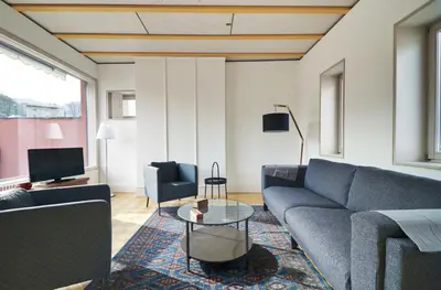 Ein Sitzbereich in der Unterkunft Duplex de charme au cœur de la vieille ville de Sion