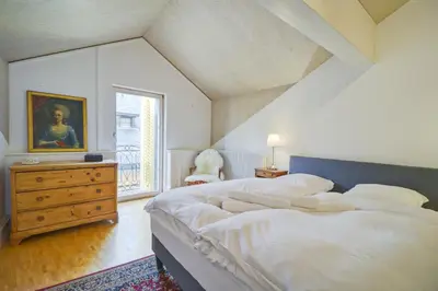 Ein Bett oder Betten in einem Zimmer der Unterkunft Duplex de charme au cœur de la vieille ville de Sion