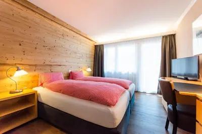 Ein Bett oder Betten in einem Zimmer der Unterkunft Hotel Weisses Kreuz
