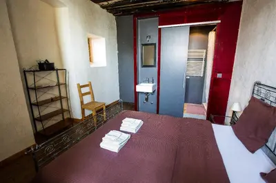 Ein Bett oder Betten in einem Zimmer der Unterkunft La Grande Maison
