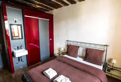 Ein Bett oder Betten in einem Zimmer der Unterkunft La Grande Maison