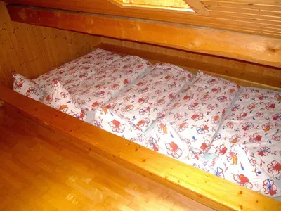 Ein Bett oder Betten in einem Zimmer der Unterkunft Berggasthaus Wasenalp