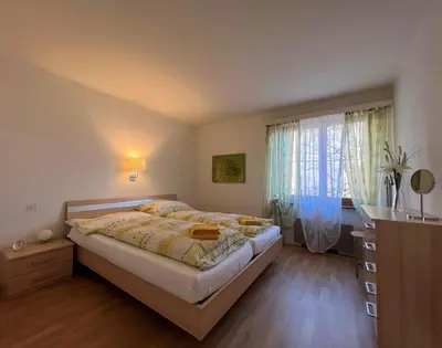 Ein Bett oder Betten in einem Zimmer der Unterkunft Brissago: Casa Collinetta H