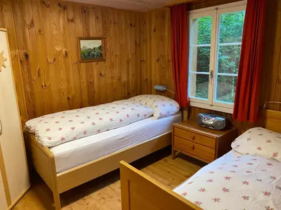 Ein Bett oder Betten in einem Zimmer der Unterkunft Chalet - Haus Ahorn Ost