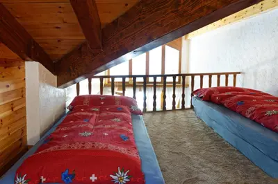 Ein Bett oder Betten in einem Zimmer der Unterkunft Appartement au centre de Zermatt (4-8 personnes)