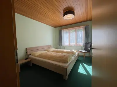 Ein Bett oder Betten in einem Zimmer der Unterkunft Ferienwohnungen Hotel Alpina