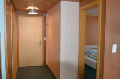 Ein Bett oder Betten in einem Zimmer der Unterkunft Ferienwohnungen Hotel Alpina