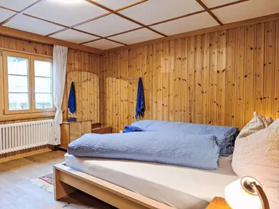 Ein Bett oder Betten in einem Zimmer der Unterkunft Apartment Chalet Alte Post by Interhome