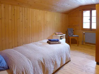 Ein Bett oder Betten in einem Zimmer der Unterkunft Apartment Chalet Alte Post by Interhome