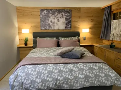Ein Bett oder Betten in einem Zimmer der Unterkunft Kirchplatz Apartment Lupus & Cervus