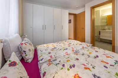Ein Bett oder Betten in einem Zimmer der Unterkunft Haus Darioli