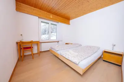 Ein Bett oder Betten in einem Zimmer der Unterkunft Haus Boccalino