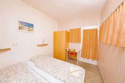 Ein Bett oder Betten in einem Zimmer der Unterkunft Haus Boccalino