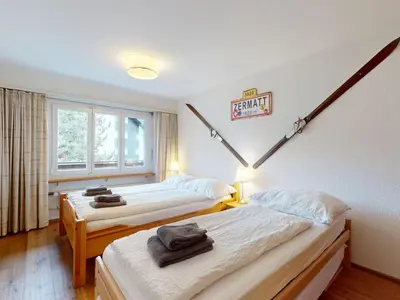 Ein Bett oder Betten in einem Zimmer der Unterkunft Beautiful apartment in Zermatt with a breathtaking view of the Matterhorn