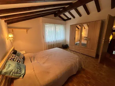Ein Bett oder Betten in einem Zimmer der Unterkunft Crans-Montana Duplex Lodge