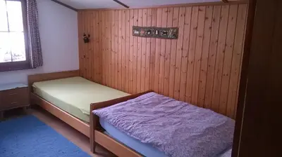 Ein Bett oder Betten in einem Zimmer der Unterkunft Chalet Petite Fleur