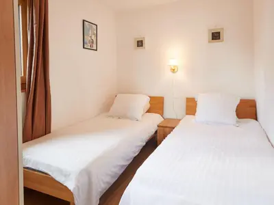 Ein Bett oder Betten in einem Zimmer der Unterkunft Chalet Genepi by Interhome
