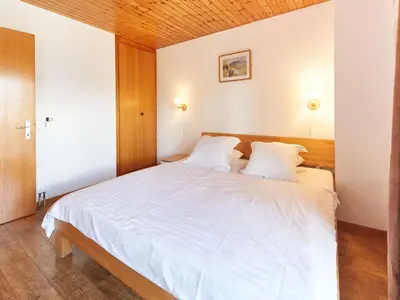Ein Bett oder Betten in einem Zimmer der Unterkunft Chalet Genepi by Interhome
