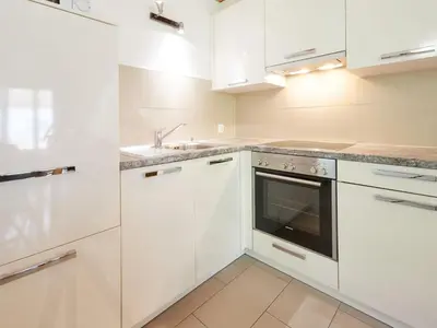 Küche/Küchenzeile in der Unterkunft Apartment Grives by Interhome