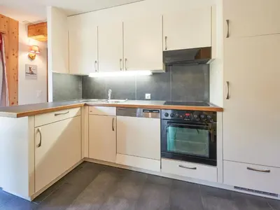 Küche/Küchenzeile in der Unterkunft Chalet Hiboux by Interhome
