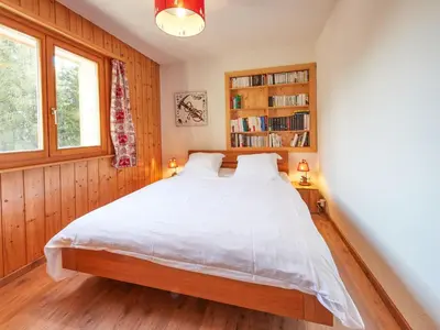 Ein Bett oder Betten in einem Zimmer der Unterkunft Chalet Hiboux by Interhome