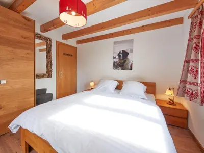 Ein Bett oder Betten in einem Zimmer der Unterkunft Chalet Hiboux by Interhome