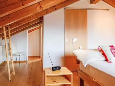 Ein Bett oder Betten in einem Zimmer der Unterkunft Chalet Le Raccard by Interhome