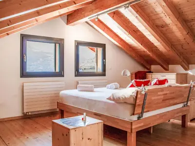 Ein Bett oder Betten in einem Zimmer der Unterkunft Chalet Le Raccard by Interhome