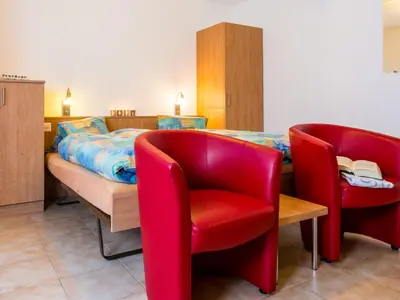 Ein Bett oder Betten in einem Zimmer der Unterkunft Chalet Piccolo by Interhome
