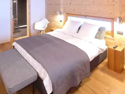 Ein Bett oder Betten in einem Zimmer der Unterkunft Chalet Chalet Astoria by Interhome