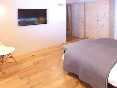 Ein Bett oder Betten in einem Zimmer der Unterkunft Chalet Chalet Astoria by Interhome