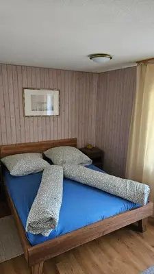 Ein Bett oder Betten in einem Zimmer der Unterkunft Schöne Ferienwohnung Nr.26 im Haus Opal