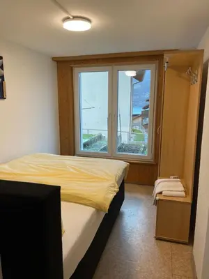 Ein Bett oder Betten in einem Zimmer der Unterkunft Francy - Partial lake view