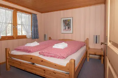 Ein Bett oder Betten in einem Zimmer der Unterkunft Chalet Iris