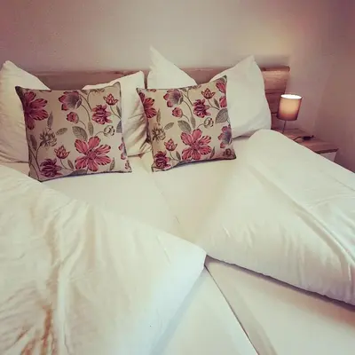 Ein Bett oder Betten in einem Zimmer der Unterkunft Hotel Rosengärtli