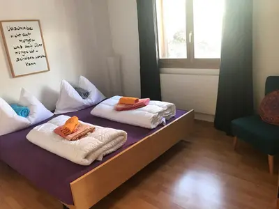 Ein Bett oder Betten in einem Zimmer der Unterkunft Lärchenwald Lodge