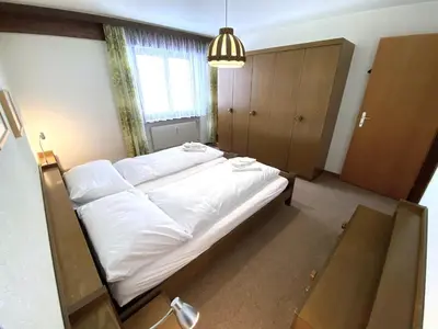 Ein Bett oder Betten in einem Zimmer der Unterkunft Lärchenwald 1706