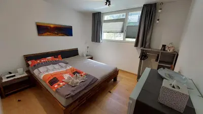 Ein Bett oder Betten in einem Zimmer der Unterkunft Ferienwohnung Meiringen
