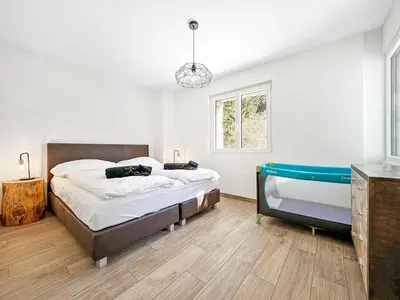 Ein Bett oder Betten in einem Zimmer der Unterkunft Chalet Familial Les Girolles aux portes d'Anzère