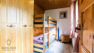 Ein Bett oder Betten in einem Zimmer der Unterkunft Chalet Independent, Termen
