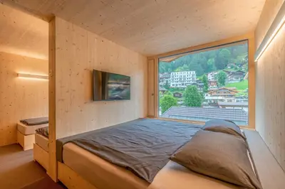 Ein Bett oder Betten in einem Zimmer der Unterkunft Revier Mountain Lodge Adelboden