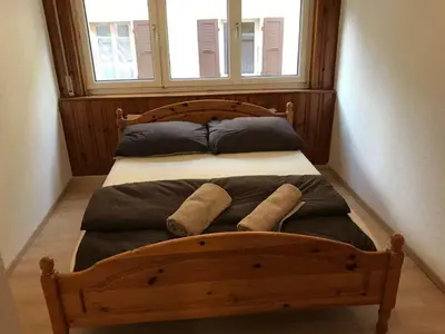 Ein Bett oder Betten in einem Zimmer der Unterkunft Apartment Sion Center