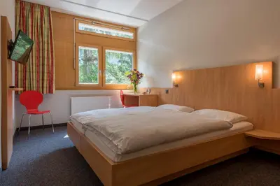 Ein Bett oder Betten in einem Zimmer der Unterkunft Sport Resort Fiesch, Garni Aletsch