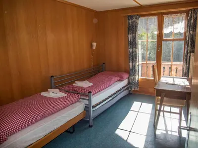 Ein Bett oder Betten in einem Zimmer der Unterkunft Chalet Sturmfang