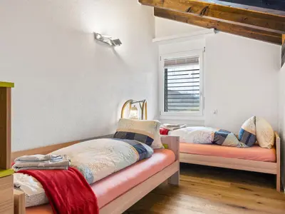 Ein Bett oder Betten in einem Zimmer der Unterkunft Apartment Castello-1 by Interhome