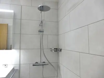 Ein Badezimmer in der Unterkunft Apartment Chalet Burgfeld by Interhome