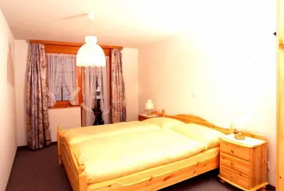 Ein Bett oder Betten in einem Zimmer der Unterkunft Castel Appartemente