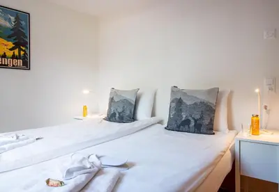 Ein Bett oder Betten in einem Zimmer der Unterkunft Chalet Waldschluecht