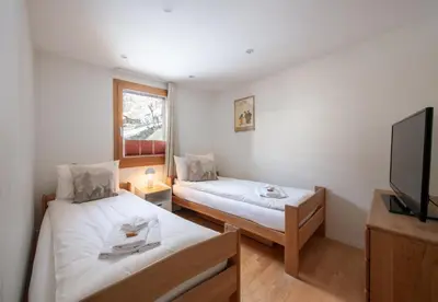Ein Bett oder Betten in einem Zimmer der Unterkunft Chalet Waldschluecht